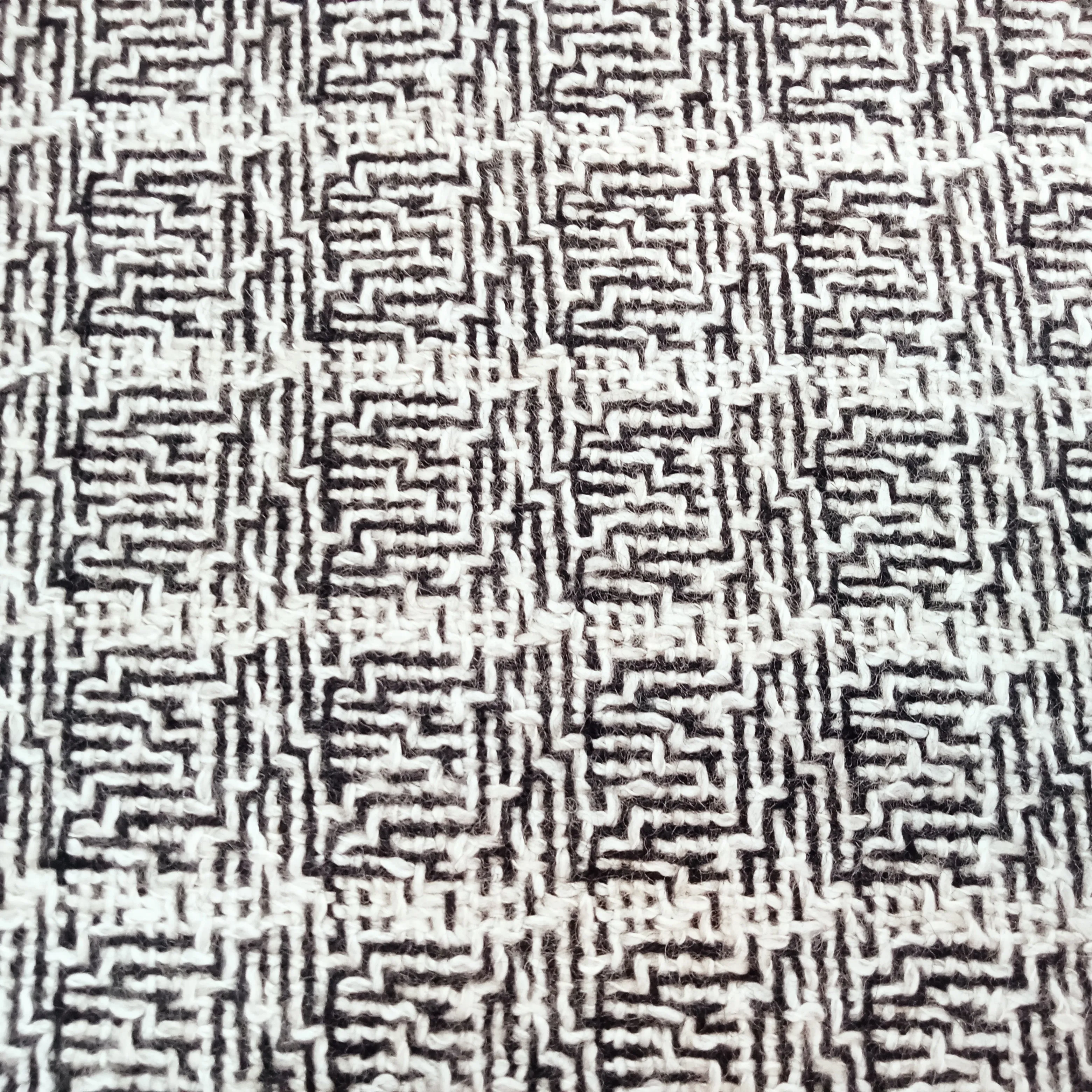 Abstract slub yarn wool blend fabric.