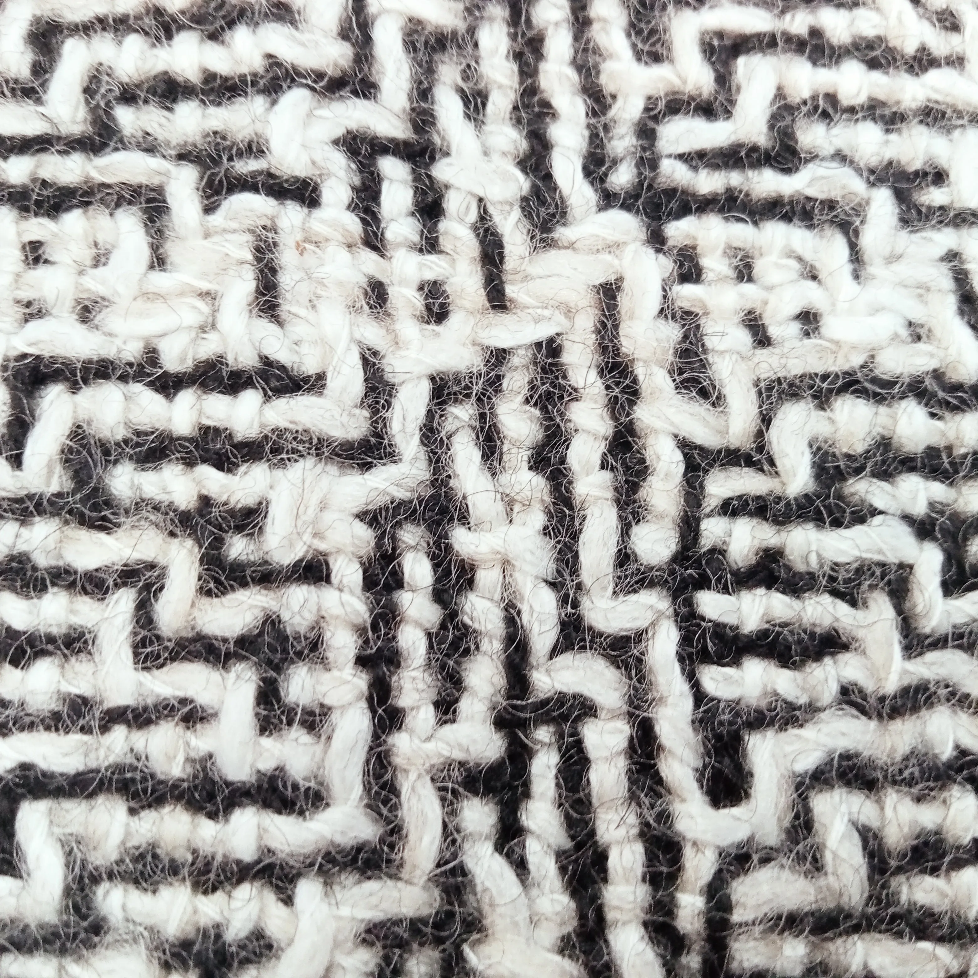 Abstract slub yarn wool blend fabric.